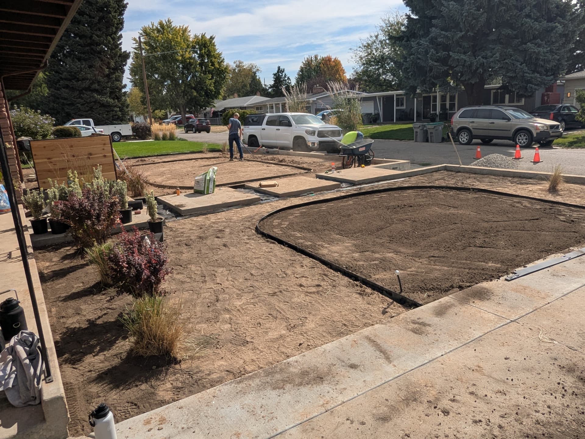 Soil preparation and bed edging with a wheelbarrow and work truck