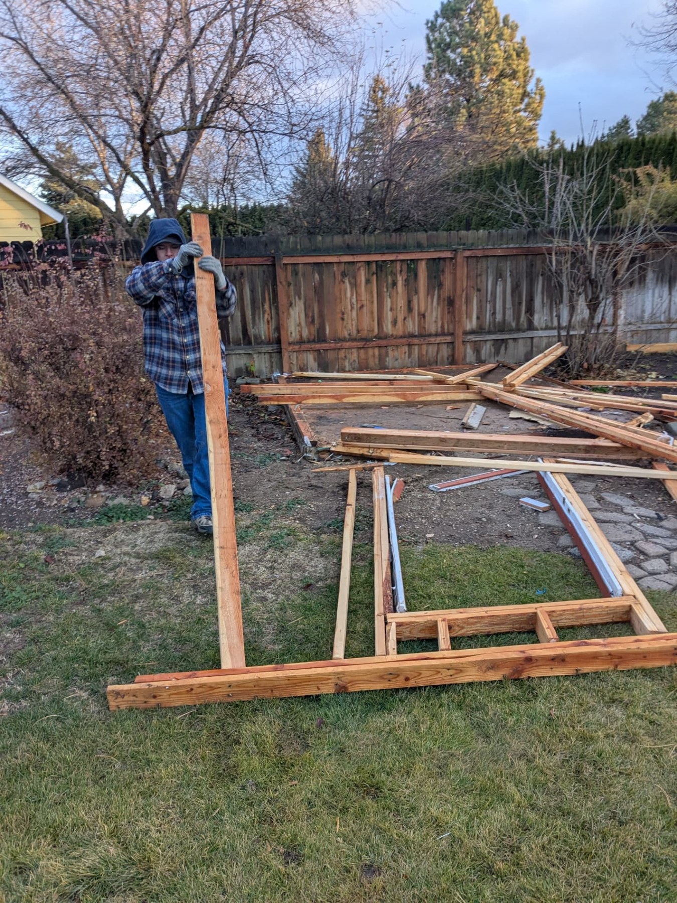 Outdoor carpentry work with timber and framing in a backyard
