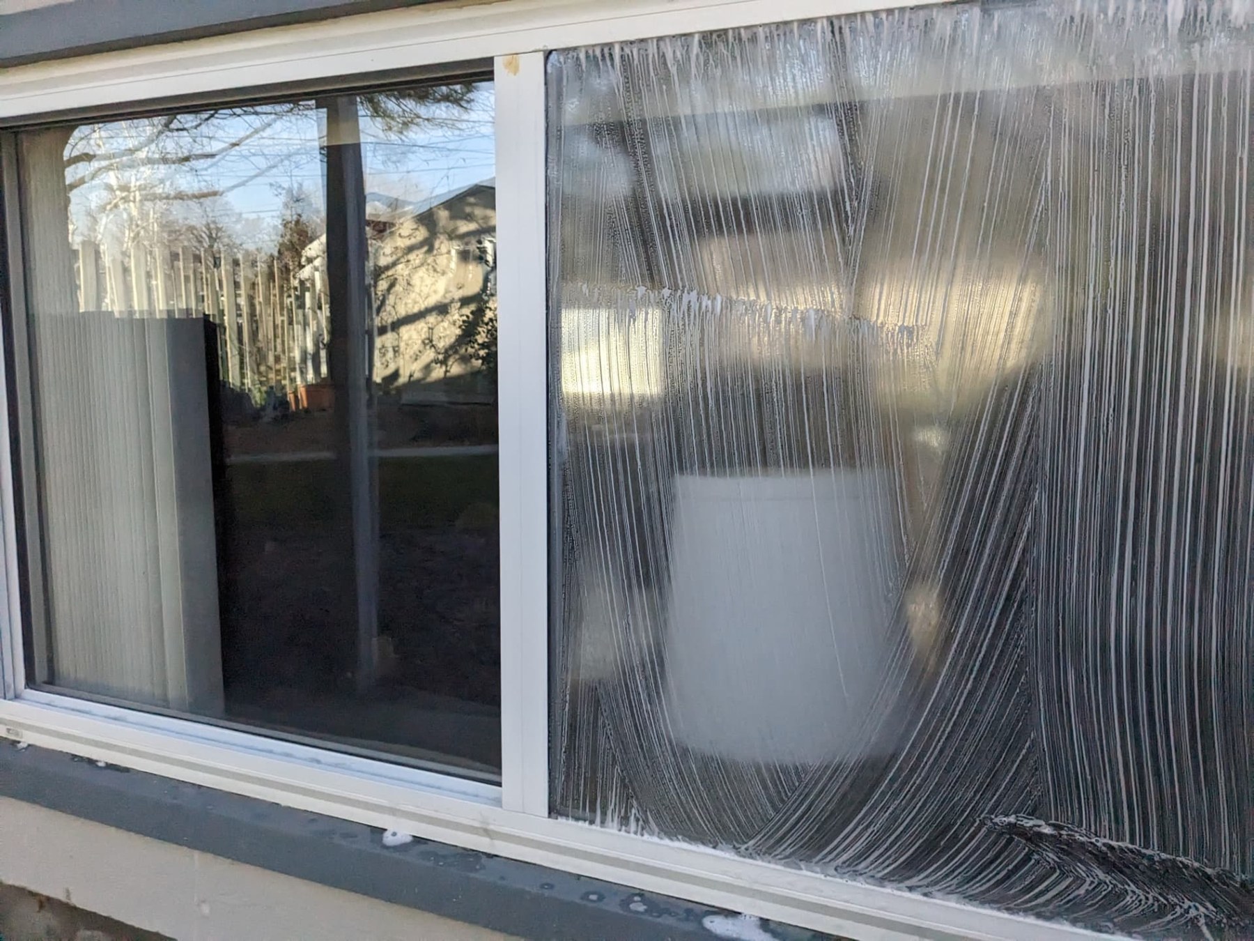 Soapy residential window glass during washing
