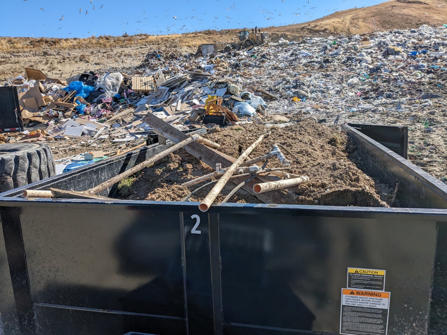 Trailer carrying construction debris at a disposal site