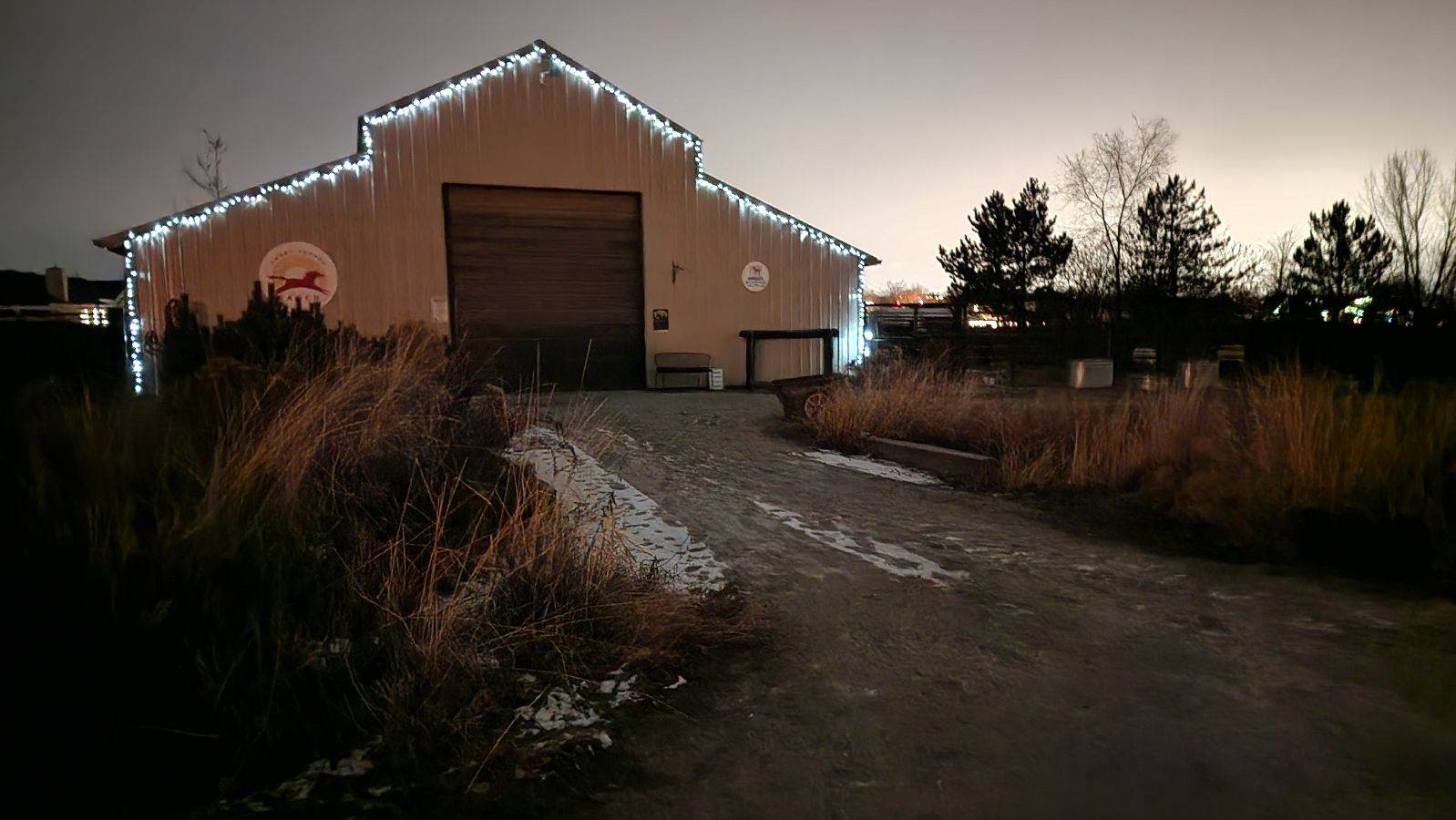 Commercial building outlined with professionally installed holiday lights